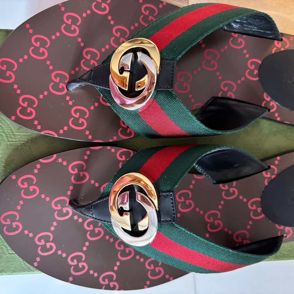 Authentic New Gucci thong sandals with Gold and silver Logo.